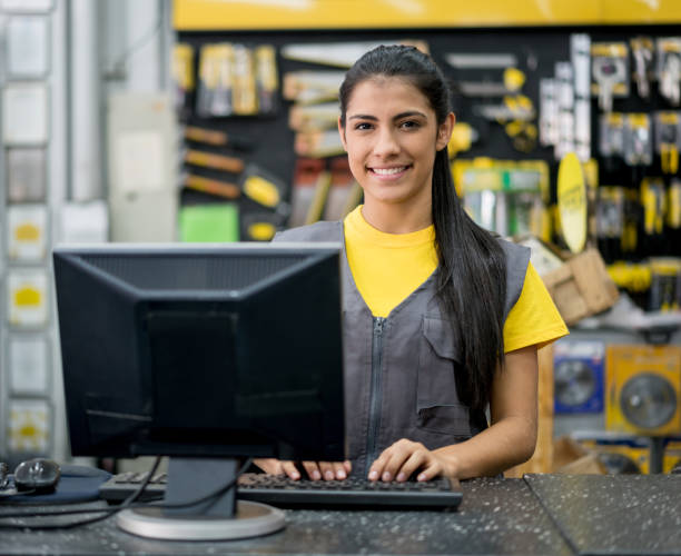 Portrait of a happy Latin American woman working at a hardware store and looking at the camera smiling